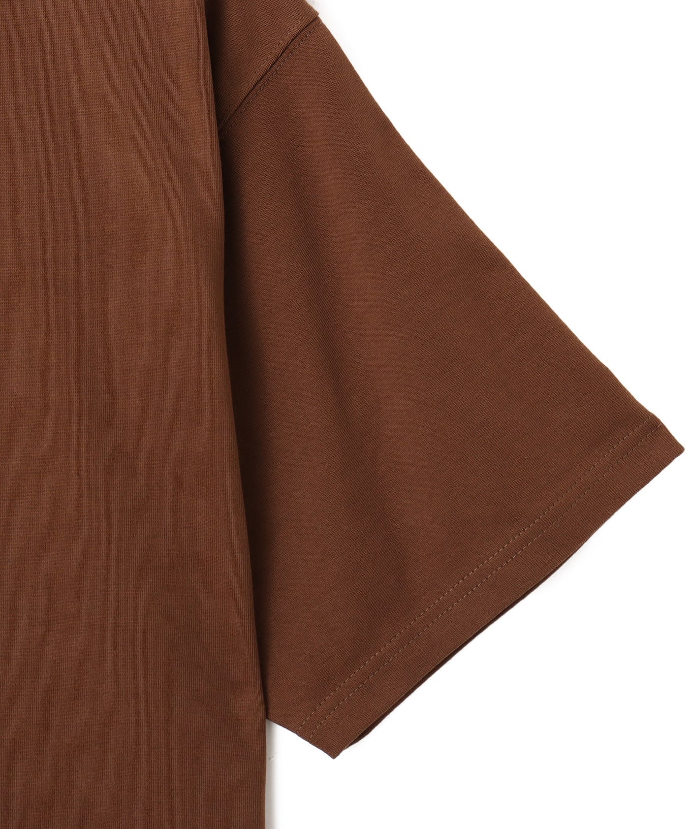 Model wearing a short-sleeved T-shirt with bold rubber-printed atmos logo on the front.