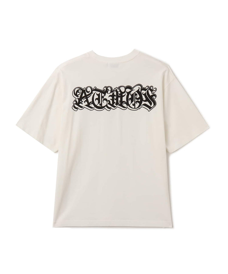 Black atmos T-shirt with Old English logo on front chest and back, styled with a vintage finish and worn by model.