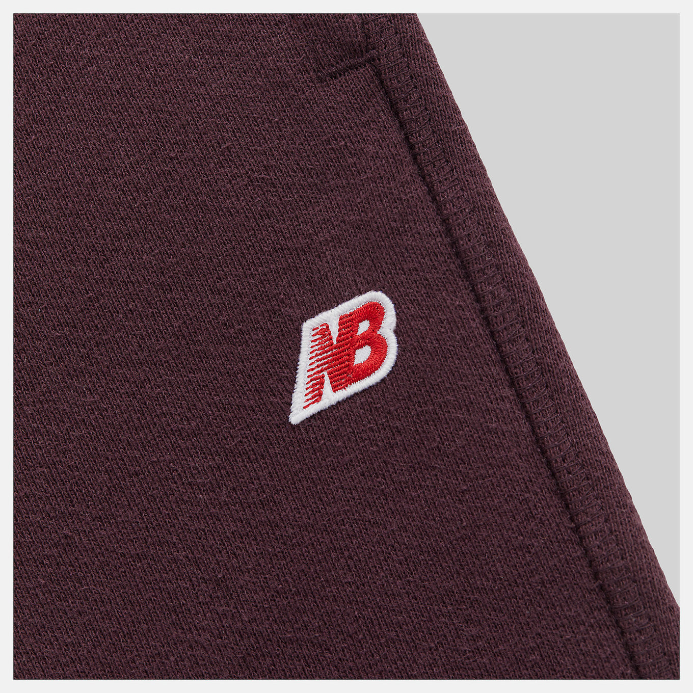 Made in USA Core Sweatpant in heavyweight French Terry, featuring a mid-rise cut, drawcord waistband, and embroidered patch logo, exemplifying timeless quality and craftsmanship.


