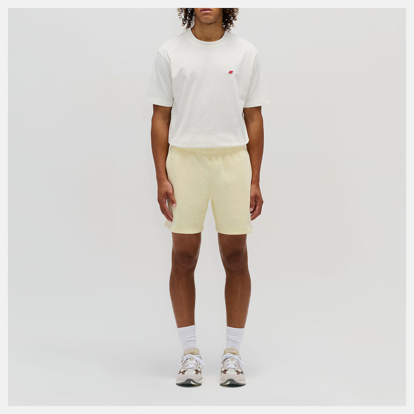 Close-up of the MADE in USA Core Short, showcasing its premium French Terry fabric, drawcord waistband, and embroidered patch logo.