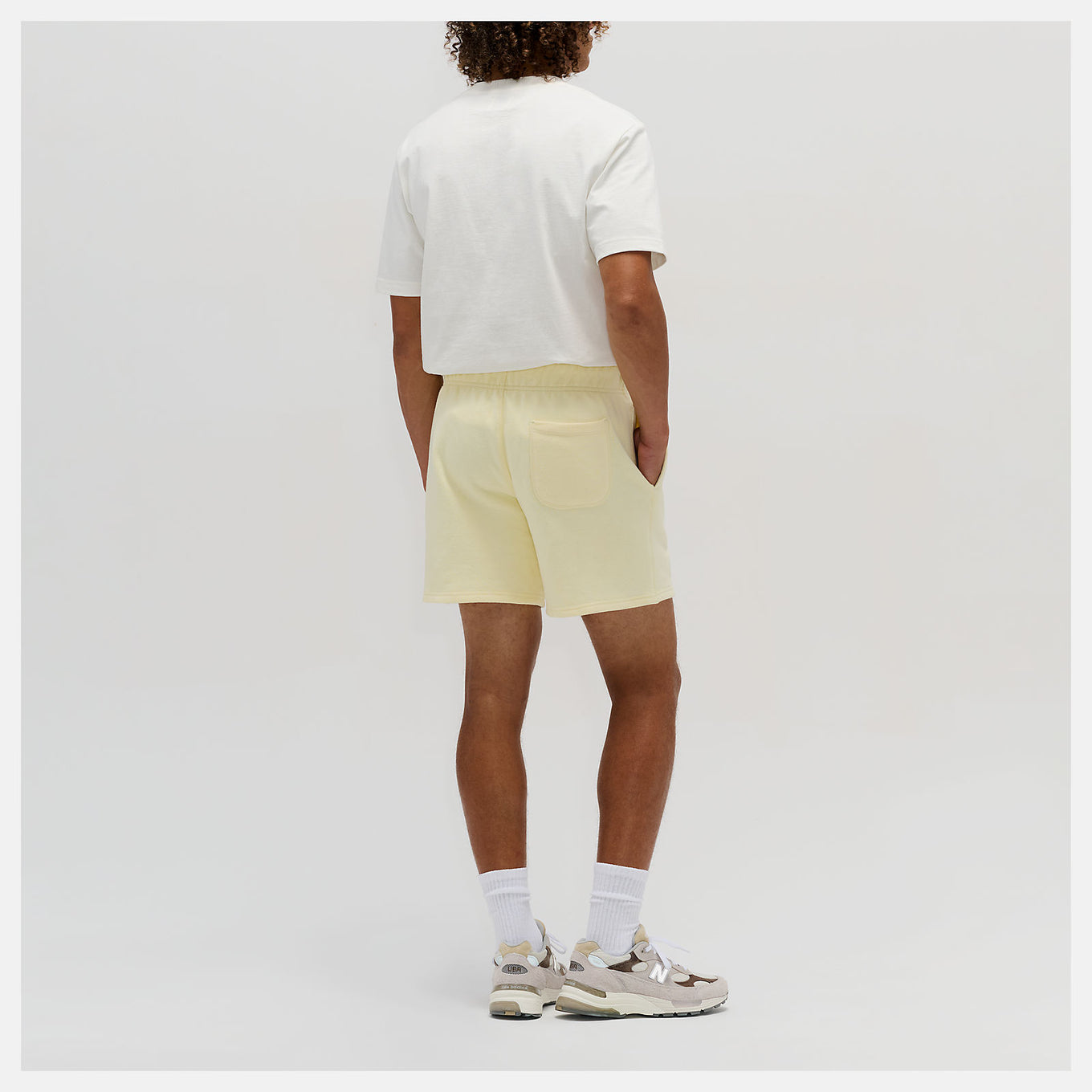 Close-up of the MADE in USA Core Short, showcasing its premium French Terry fabric, drawcord waistband, and embroidered patch logo.