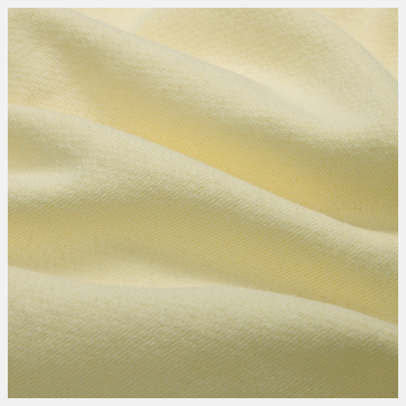 Close-up of the MADE in USA Core Short, showcasing its premium French Terry fabric, drawcord waistband, and embroidered patch logo.