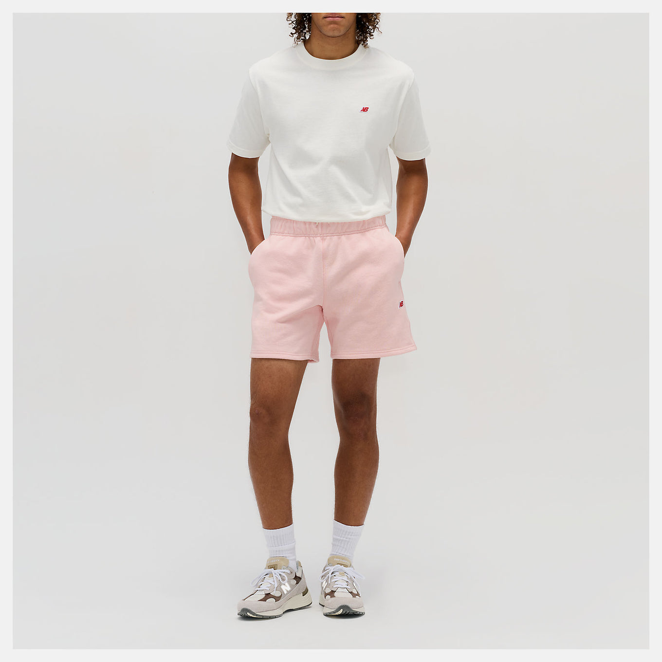 New Balance Made in USA Core Short with premium French Terry fabric, mid-rise cut, drawcord waistband, and embroidered patch logo.