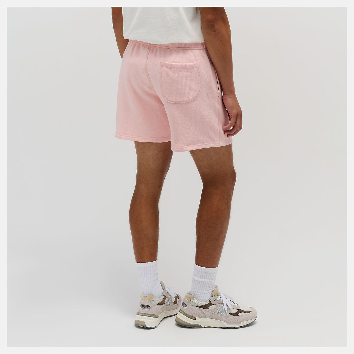 New Balance Made in USA Core Short with premium French Terry fabric, mid-rise cut, drawcord waistband, and embroidered patch logo.