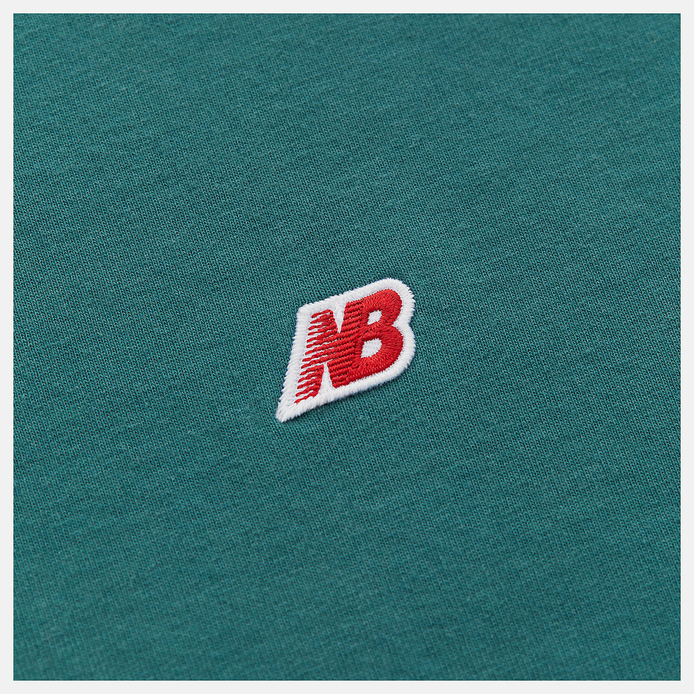 Made in USA Core T-Shirt with classic crew silhouette, embroidered patch logo, and premium materials, representing timeless quality and craftsmanship.


