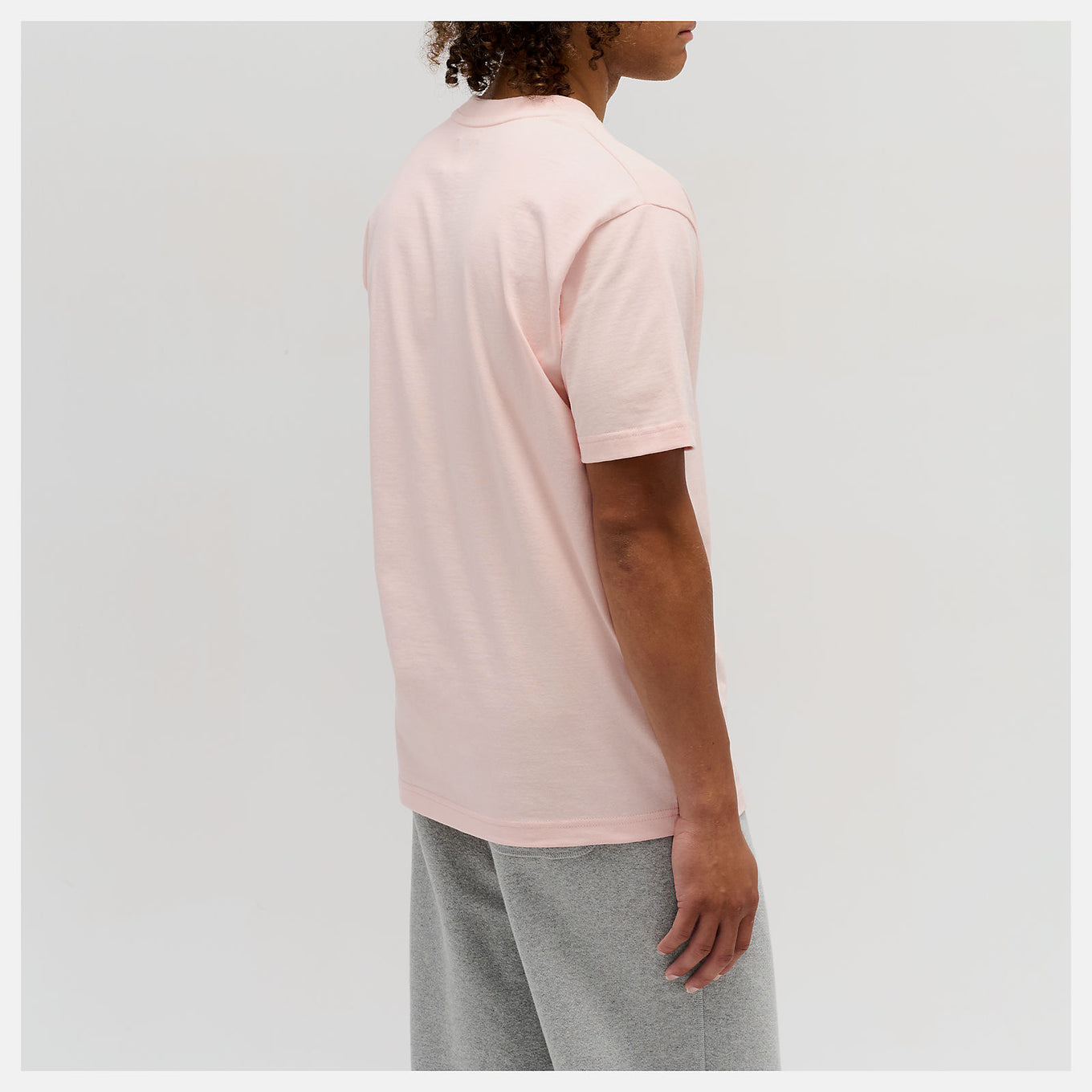 Close-up of the MADE in USA Core T-Shirt, highlighting its premium fabric, classic crewneck silhouette, and embroidered patch logo.