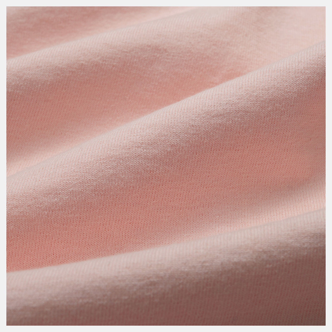 Close-up of the MADE in USA Core T-Shirt, highlighting its premium fabric, classic crewneck silhouette, and embroidered patch logo.