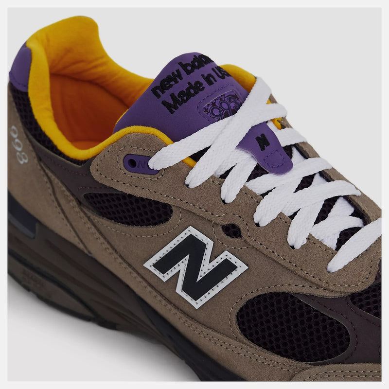 New Balance U993MU Made in USA sneakers in gray suede and brown mesh with white laces and reflective logo.


