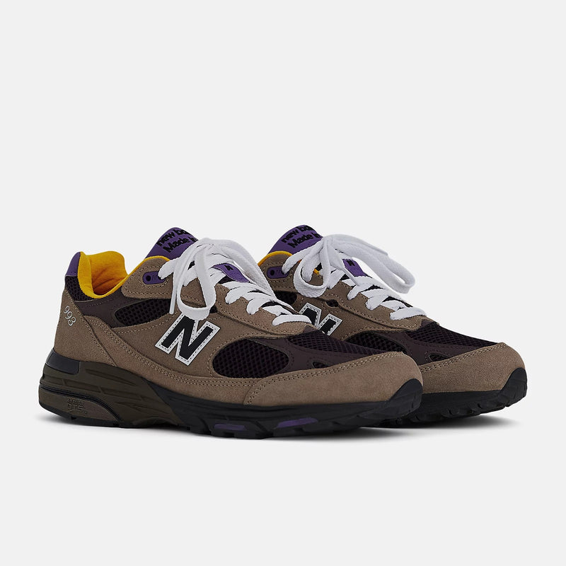 New Balance U993MU Made in USA sneakers in gray suede and brown mesh with white laces and reflective logo.


