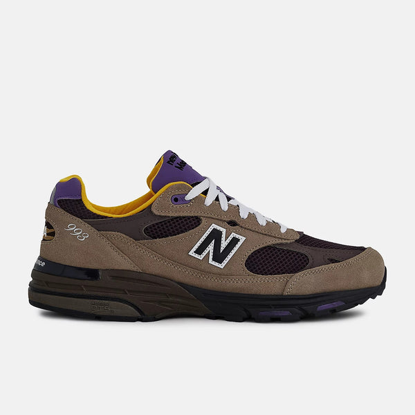 New Balance U993MU Made in USA sneakers in gray suede and brown mesh with white laces and reflective logo.


