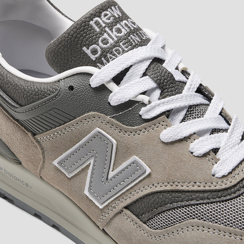 New Balance 997 'Grey' sneaker showcasing its mesh base, suede overlays, and textured leather, featuring ABZORB and ENCAP cushioning for enhanced comfort.