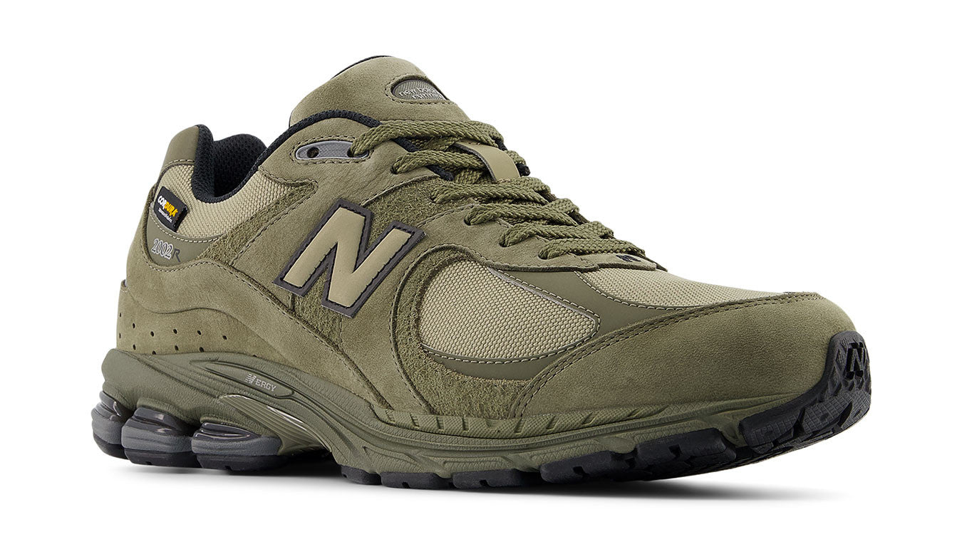 New Balance 2002R trainers for men with Cordura upper, suede and pigskin overlays, ABZORB midsole cushioning, and Stability Web outsole for comfort and support.