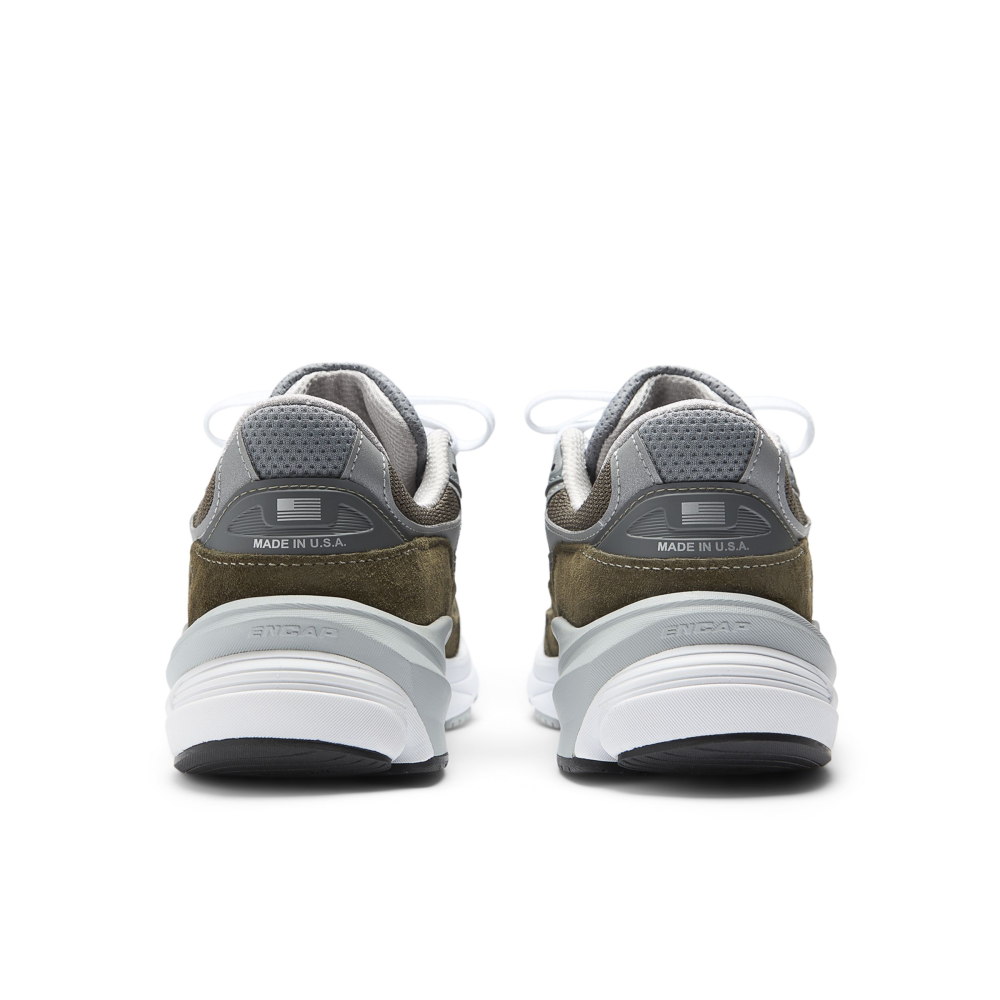 New Balance Made in USA 990v6 sneaker with a streamlined suede and mesh upper, FuelCell cushioning, and a modern grey colorway.