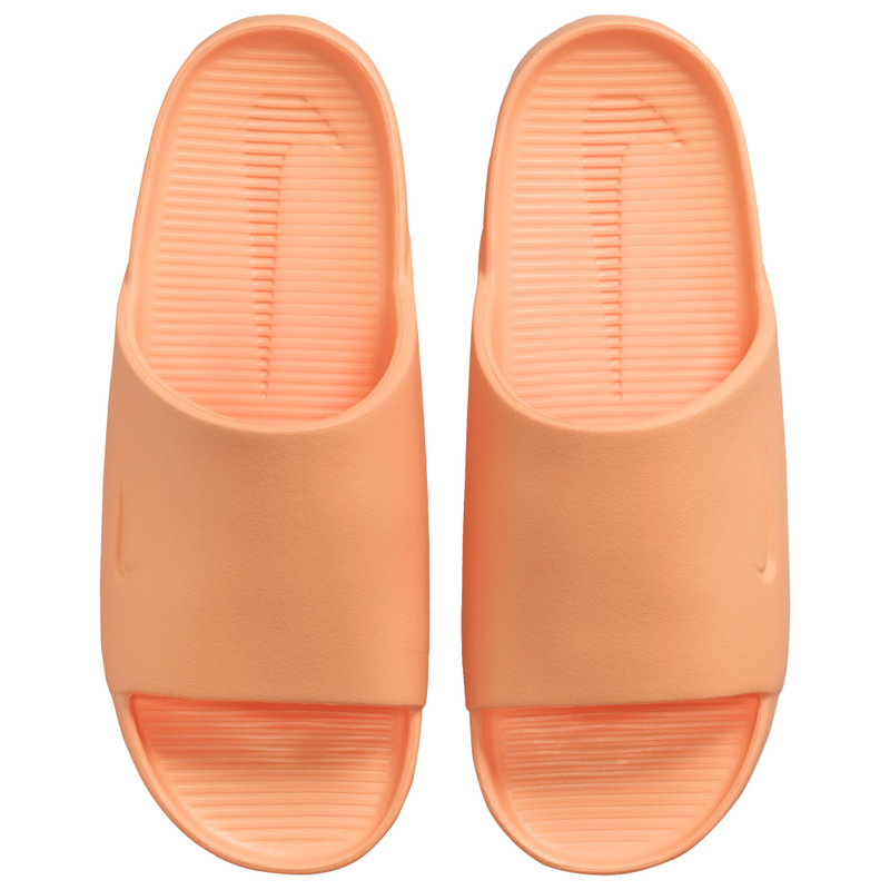 Lightweight foam slides with a minimalist design, featuring a smooth, seamless fit and textured footbed for grip, perfect for the beach, pool, or city.