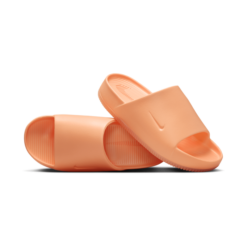 Lightweight foam slides with a minimalist design, featuring a smooth, seamless fit and textured footbed for grip, perfect for the beach, pool, or city.