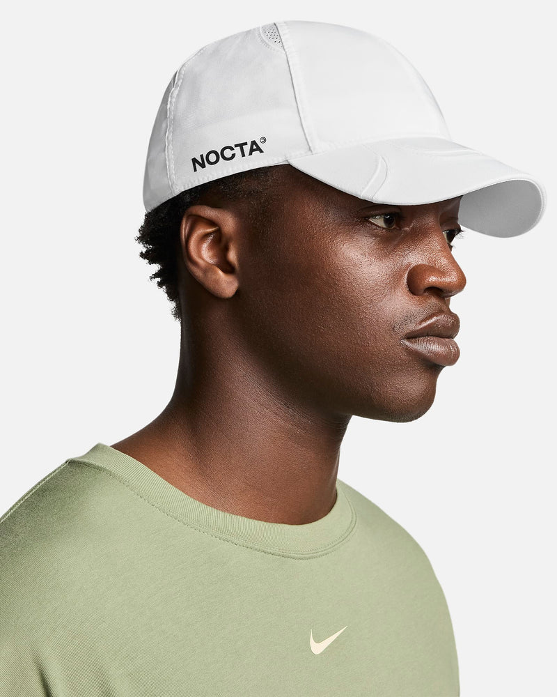 This sleek hat features embroidered graphics and a NOCTA-branded adjustable slide to find the perfect fit.