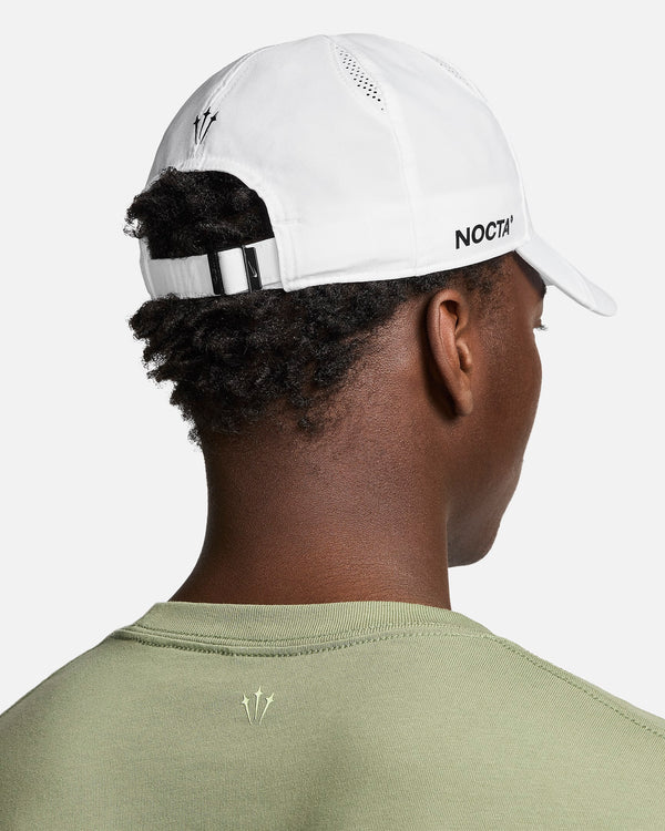 This sleek hat features embroidered graphics and a NOCTA-branded adjustable slide to find the perfect fit.