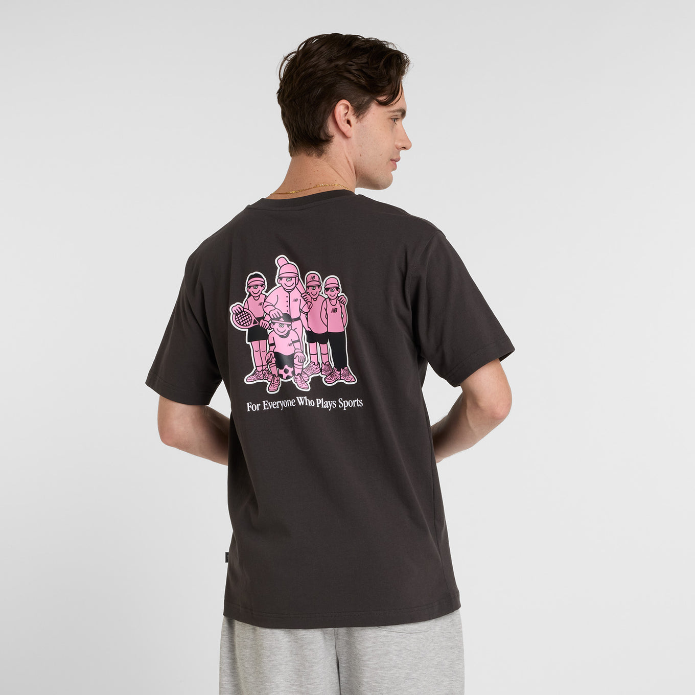 Face Oka x New Balance t-shirt featuring bold colors and playful graphic art by Tokyo-based illustrator