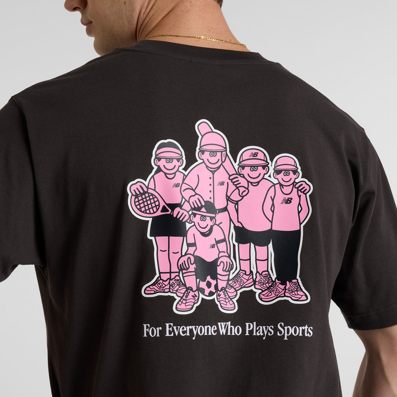 Face Oka x New Balance t-shirt featuring bold colors and playful graphic art by Tokyo-based illustrator