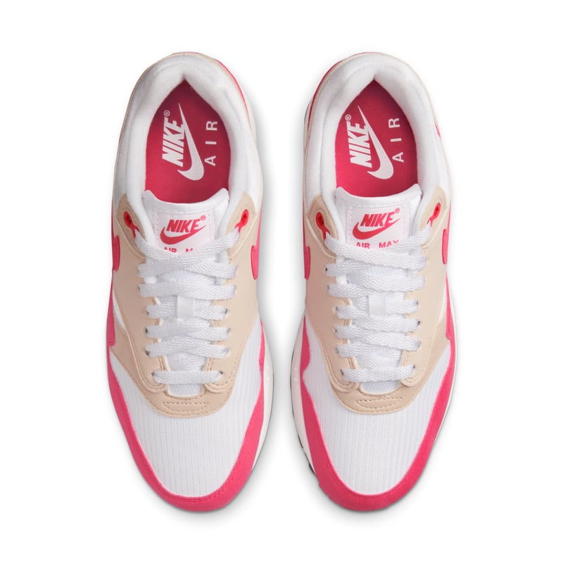 Classic sneaker design with suede Swoosh, 'Team Red' color scheme, 'Light Orewood Brown' accents, and 'Aster Pink' detail on outsole