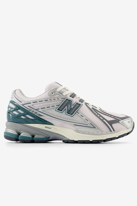 New Balance 1906R running shoes with ACTEVA LITE cushioning, N-ergy outsole, and mesh upper featuring synthetic overlays.


