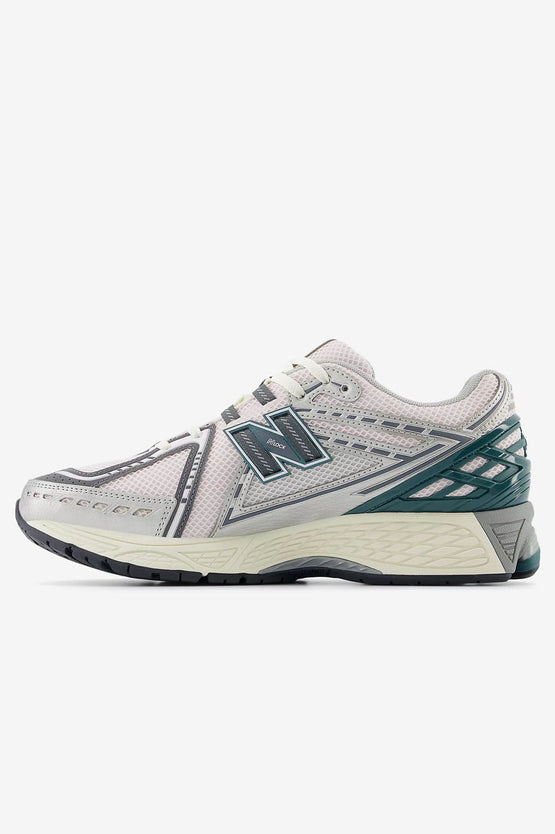 New Balance 1906R running shoes with ACTEVA LITE cushioning, N-ergy outsole, and mesh upper featuring synthetic overlays.


