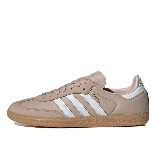 Adidas Samba OG shoes with smooth leather upper and gum rubber outsole, featuring metallic gold accents and serrated 3-Stripes.