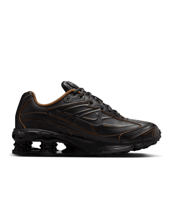 Nike Shox Ride 2 sneaker featuring four Shox columns, Max Air technology, and premium genuine leather upper for durability and comfort.