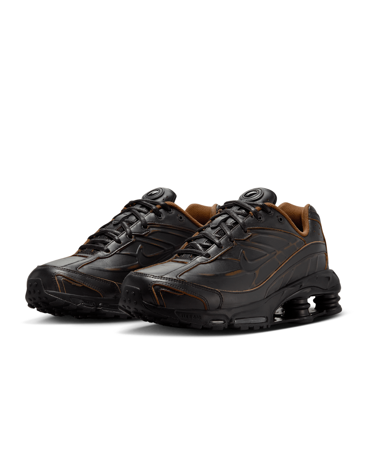 Nike Shox Ride 2 sneaker featuring four Shox columns, Max Air technology, and premium genuine leather upper for durability and comfort.