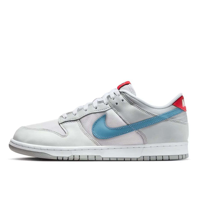 Nike Dunk silver superhero edition 20th anniversary with Flat Silver and Neutral Grey leather, airy textiles, Aegean Storm, and Gym Red accents.