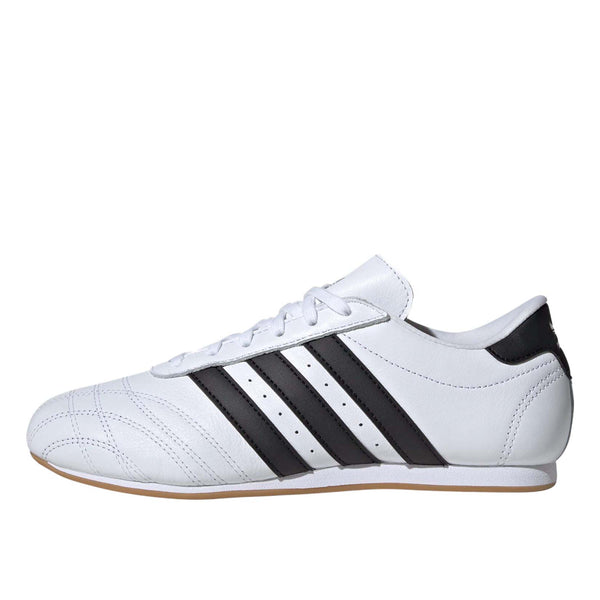 Sleek adidas trainers with minimalist design, soft leather, quilted toes, and classic 3-Stripes.