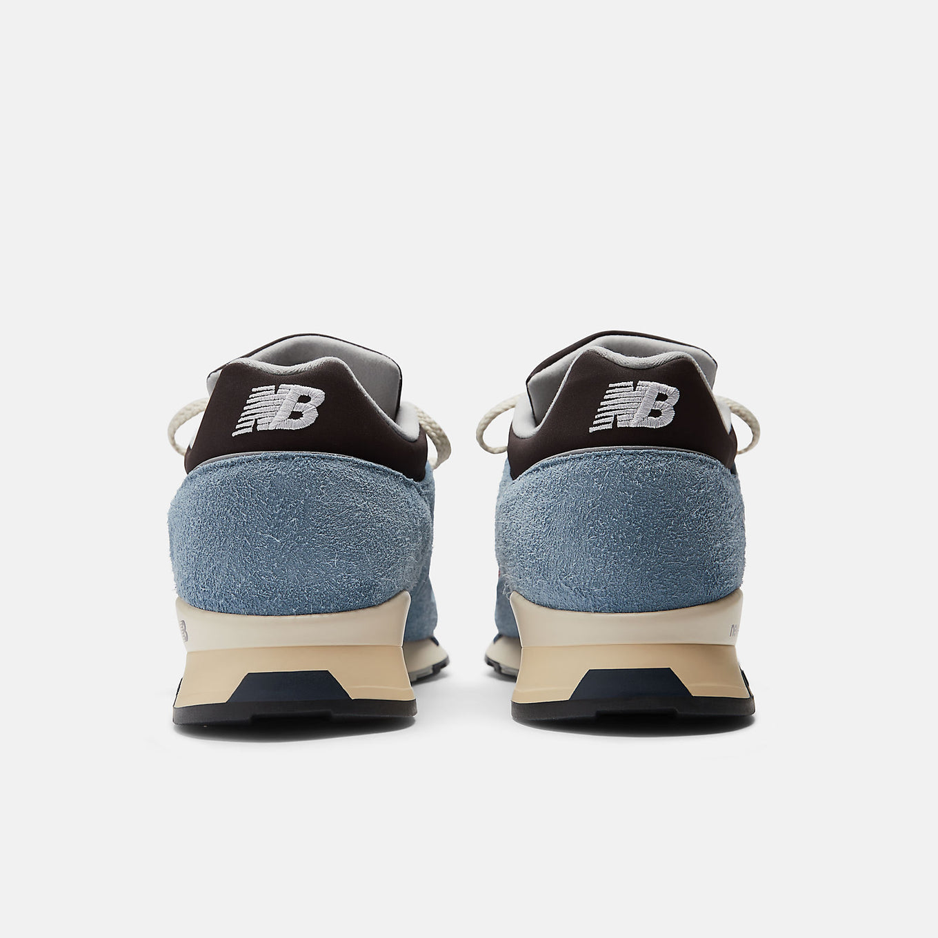 New Balance Made in UK 1500 ‘Coffee Pop’ sneaker with dark brown mesh, pale blue suede overlays, and red-orange synthetic details.