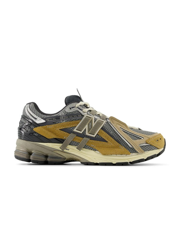 New Balance U1906AA sneaker with grey mesh upper, beige and brown overlays, NLock Lacing system, and cushioned sole with N-Ergy and ABZORB SBS pods.