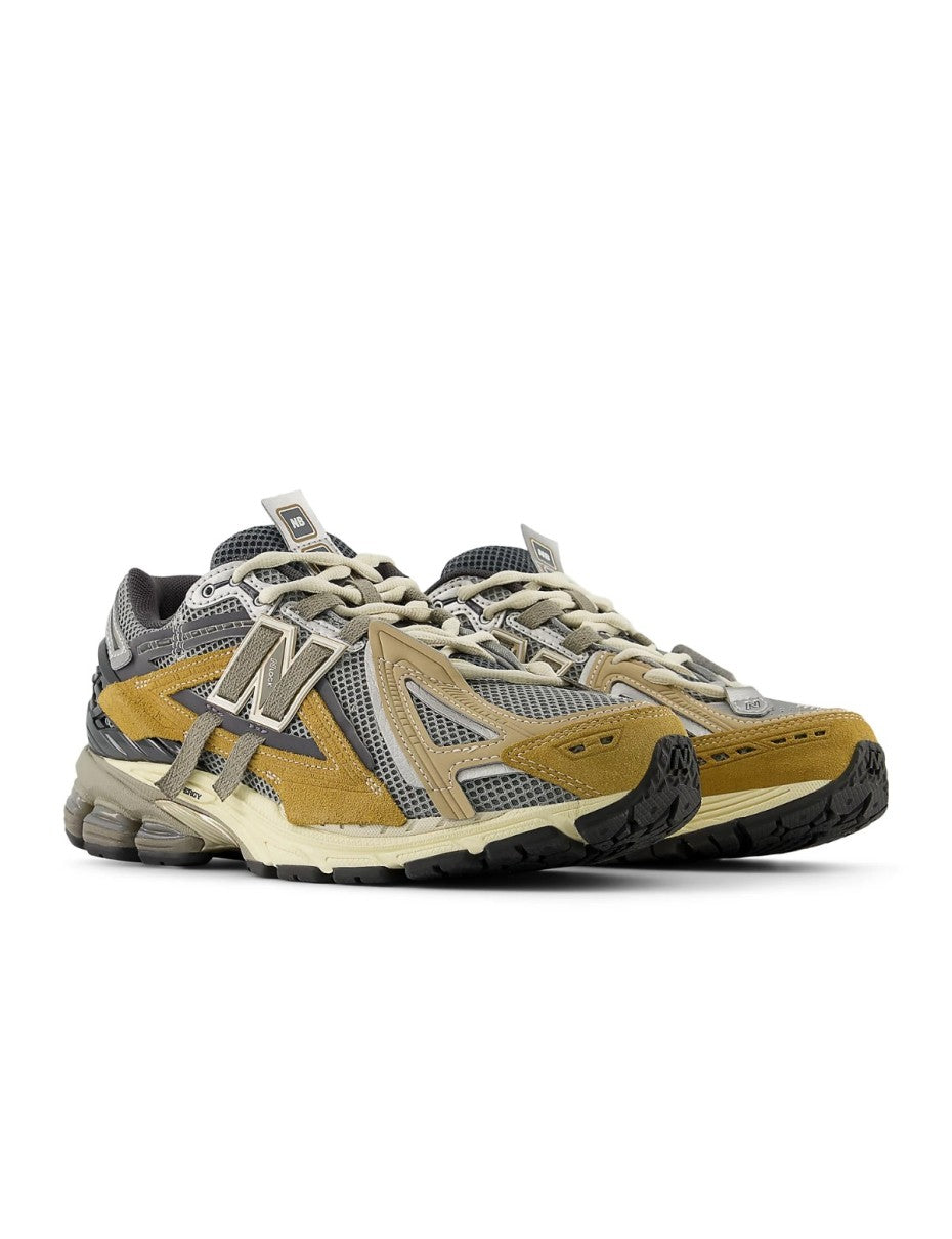 New Balance U1906AA sneaker with grey mesh upper, beige and brown overlays, NLock Lacing system, and cushioned sole with N-Ergy and ABZORB SBS pods.