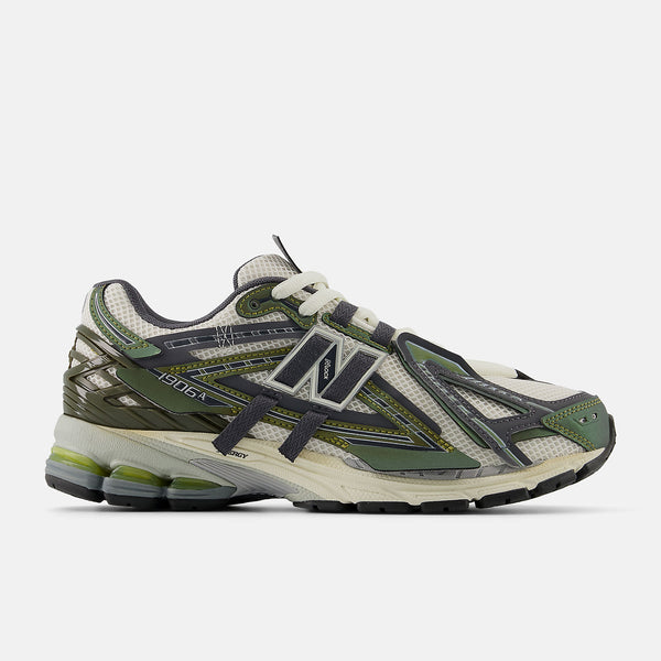 New Balance 1906A sneakers with mesh upper and ABZORB SBS heel cushioning in a retro running silhouette.