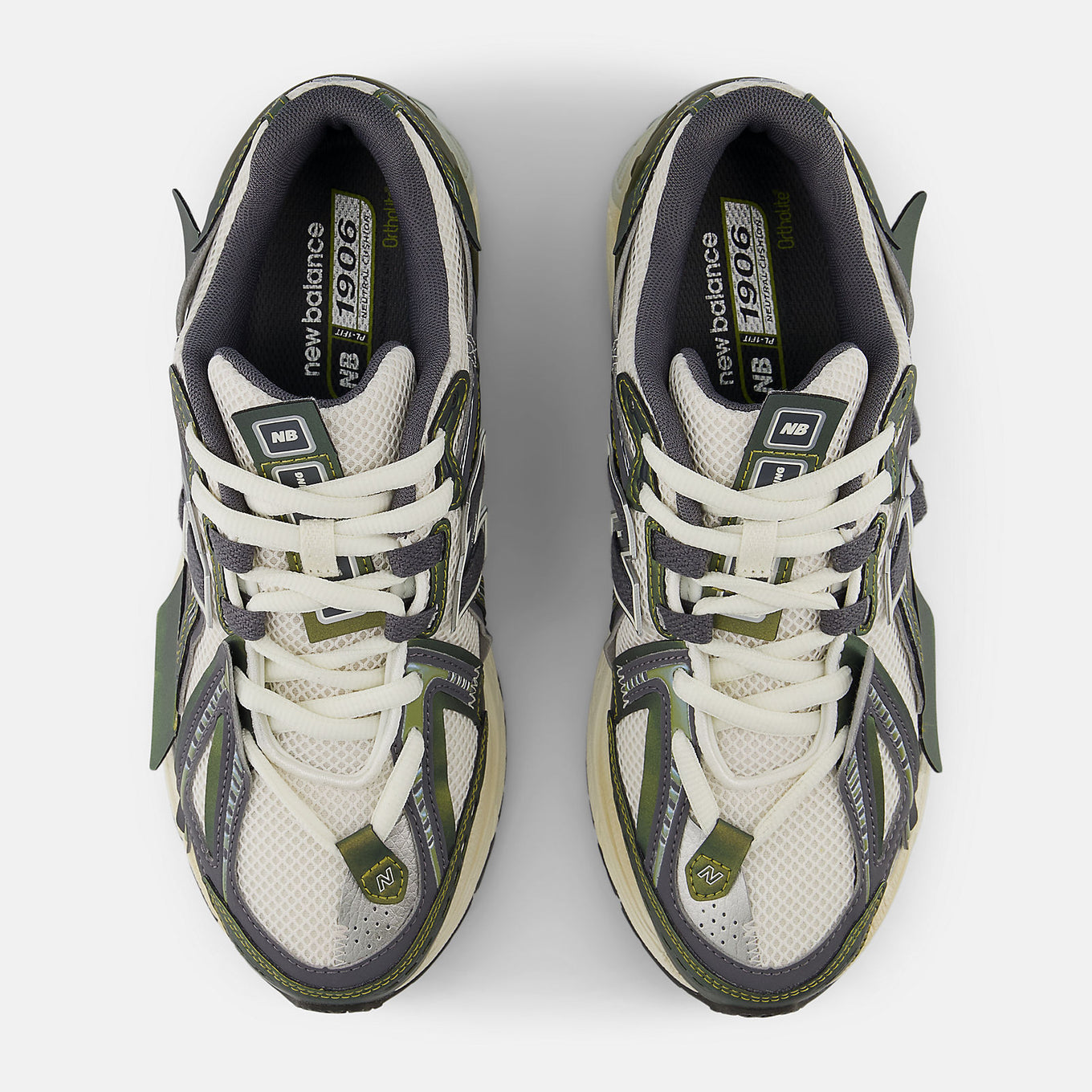 New Balance 1906A sneakers with mesh upper and ABZORB SBS heel cushioning in a retro running silhouette.