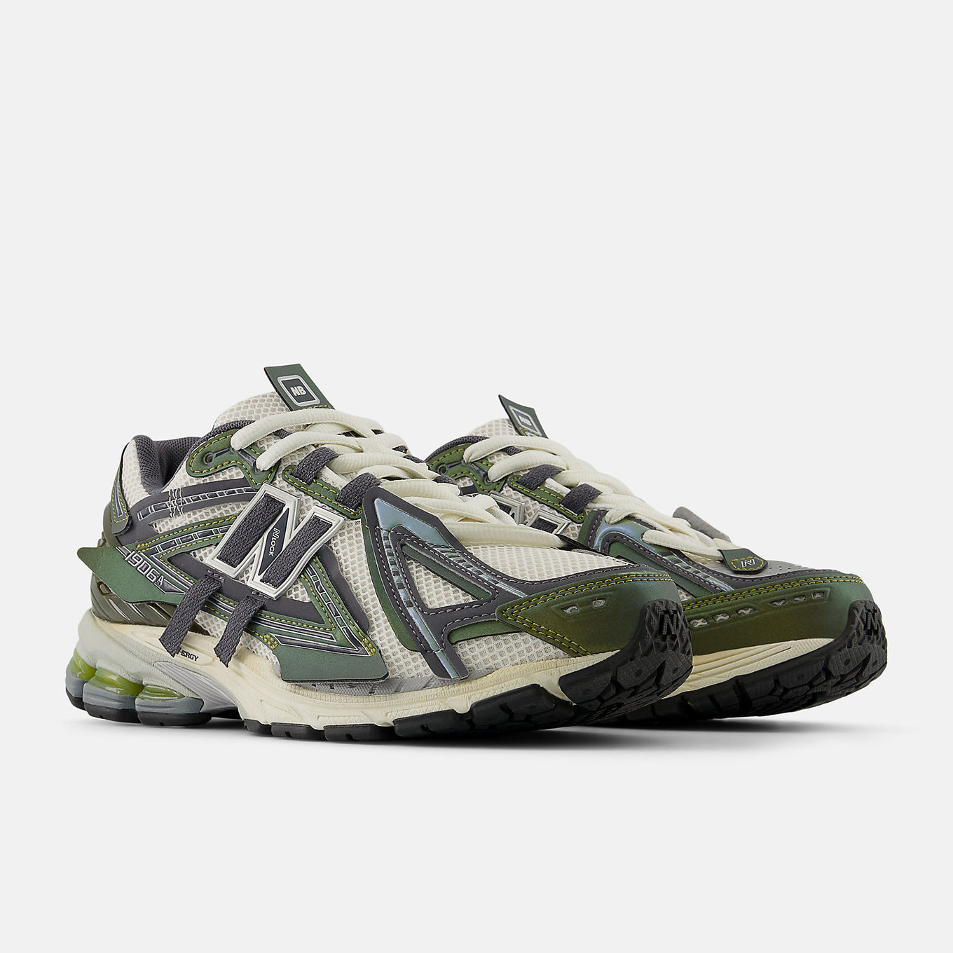 New Balance 1906A sneakers with mesh upper and ABZORB SBS heel cushioning in a retro running silhouette.