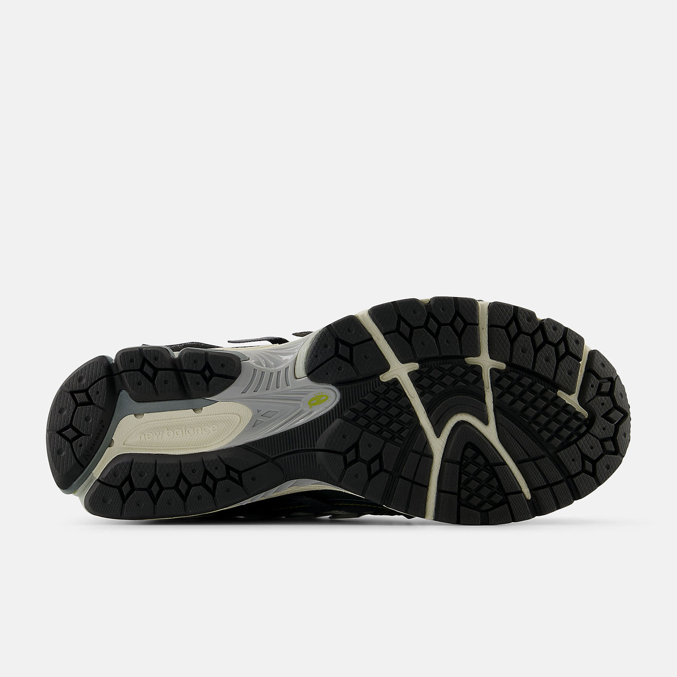 New Balance 1906A sneakers with mesh upper and ABZORB SBS heel cushioning in a retro running silhouette.