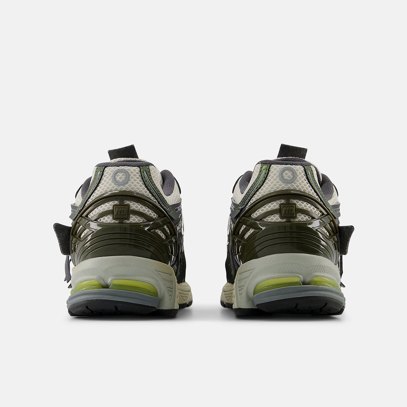 New Balance 1906A sneakers with mesh upper and ABZORB SBS heel cushioning in a retro running silhouette.