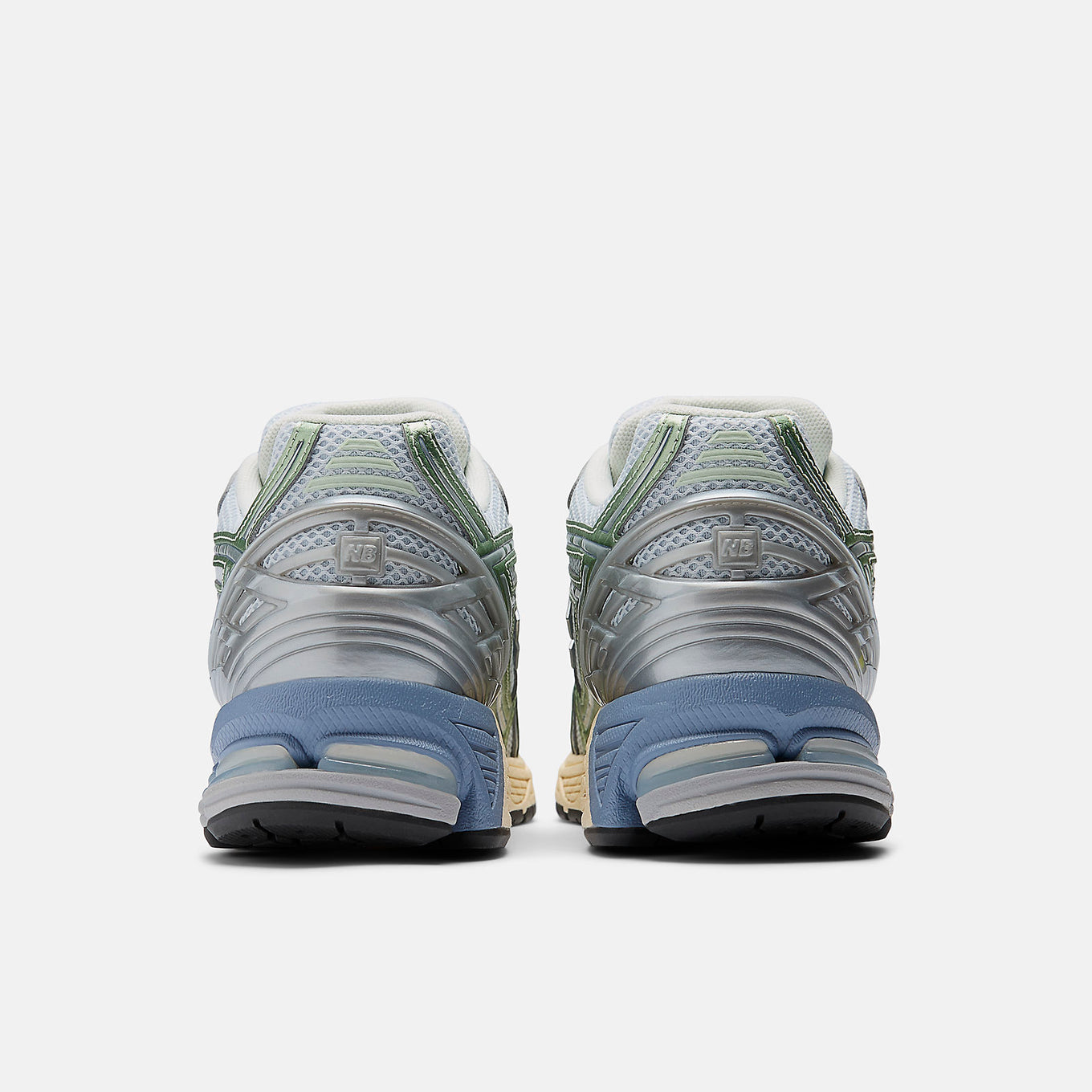 New Balance 1906R sneaker with open-holed mesh upper, curvilinear overlays, and advanced cushioning sole