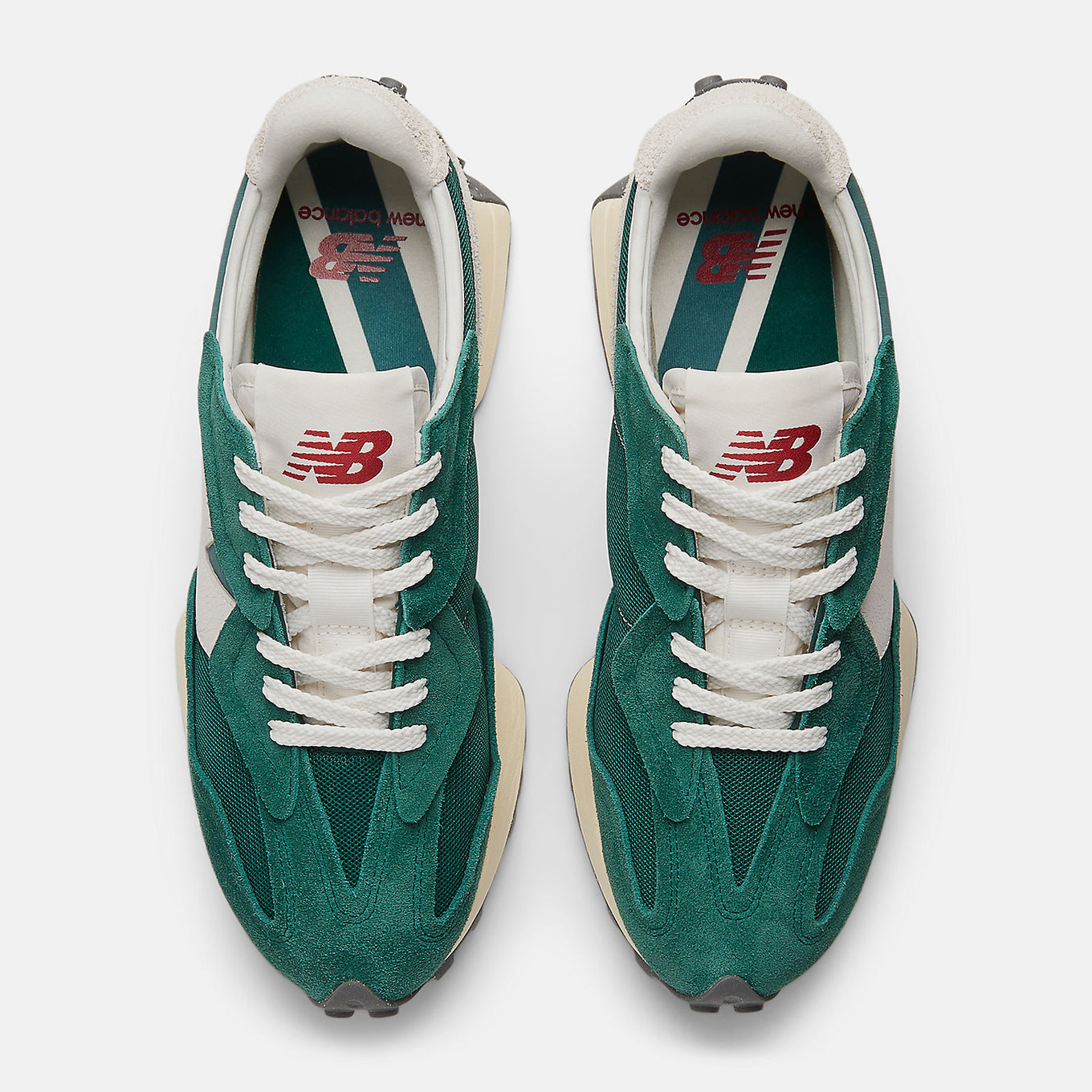 New Balance 327 sneaker featuring bold 'N' branding, angular wedge silhouette, and trail-inspired lug outsole, blending '70s design with modern updates.