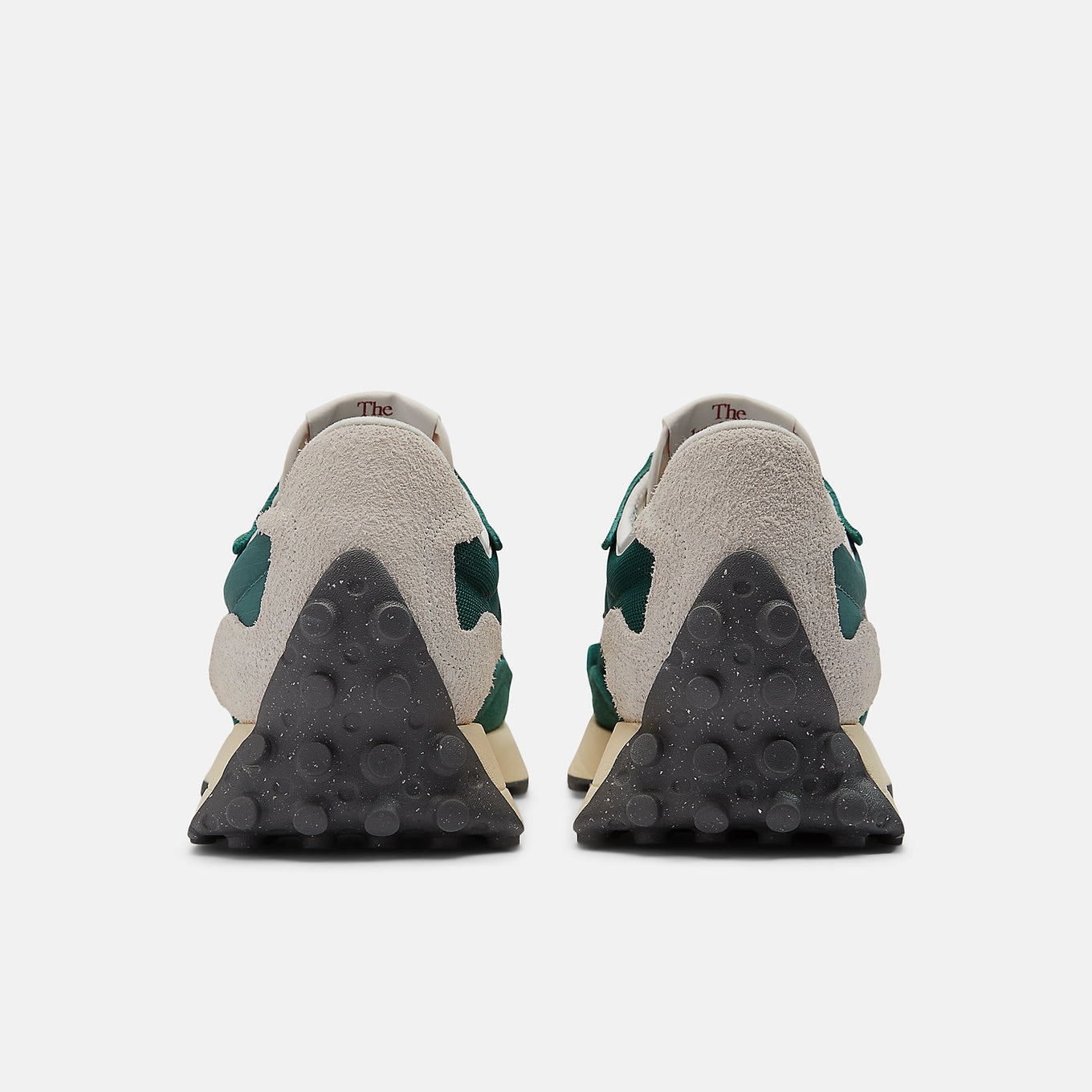 New Balance 327 sneaker featuring bold 'N' branding, angular wedge silhouette, and trail-inspired lug outsole, blending '70s design with modern updates.