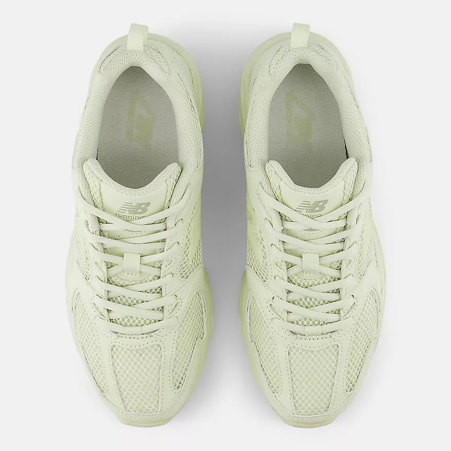 New Balance 530 sneakers with mesh and synthetic upper, ABZORB midsole, and retro-inspired running shoe silhouette.