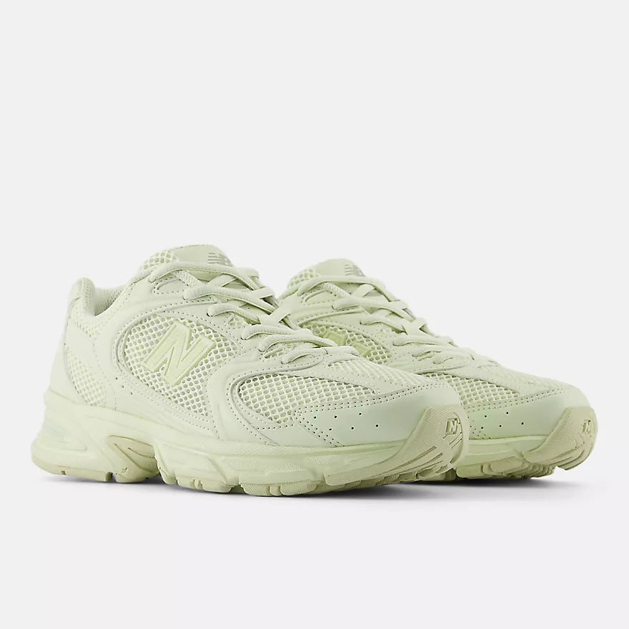 New Balance 530 sneakers with mesh and synthetic upper, ABZORB midsole, and retro-inspired running shoe silhouette.