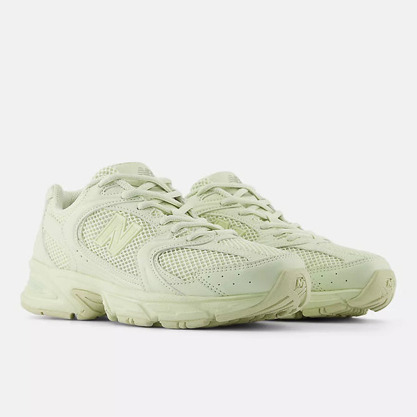 New Balance 530 sneakers with mesh and synthetic upper, ABZORB midsole, and retro-inspired running shoe silhouette.