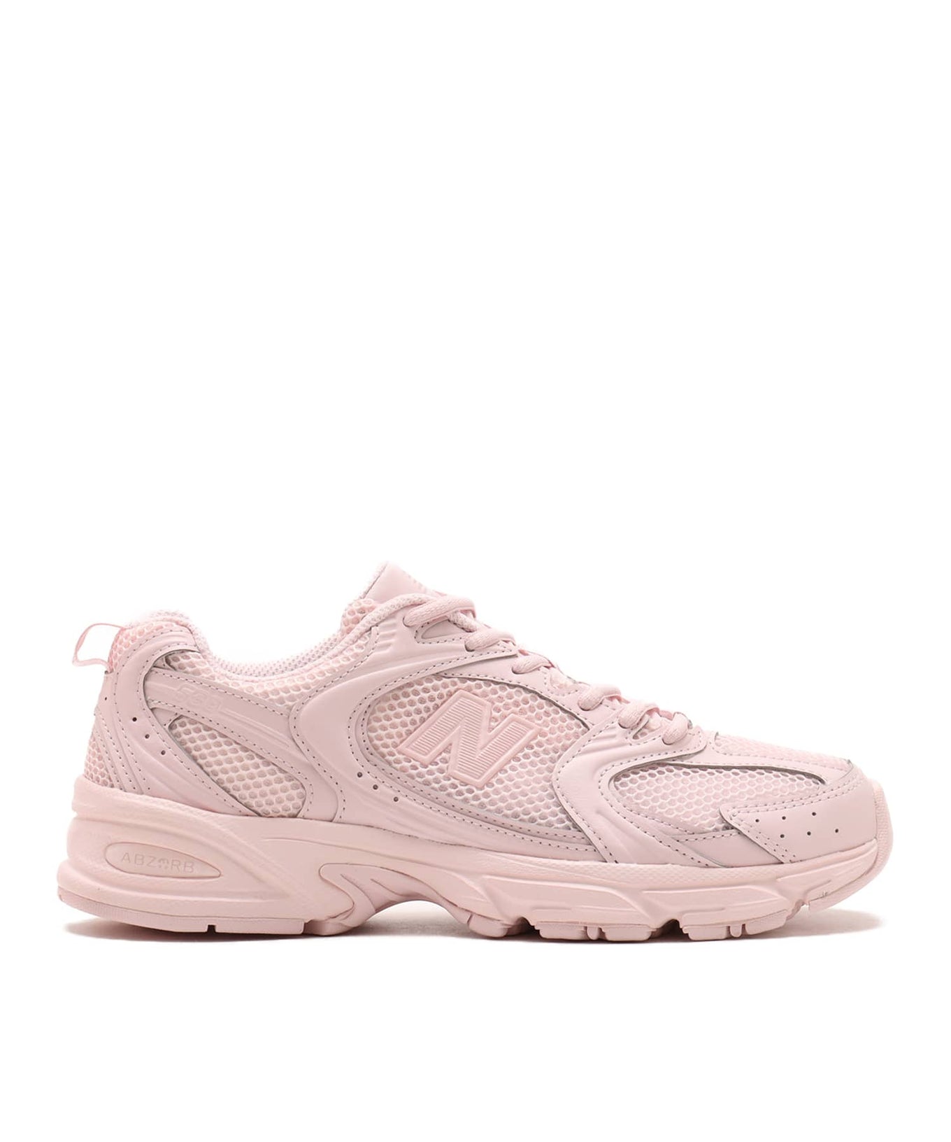 New Balance 530 sneaker in exclusive light pink colorway, featuring elegant curves and ABZORB midsole for spring-ready style