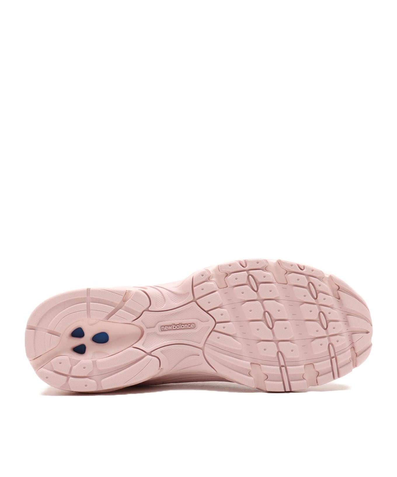 New Balance 530 sneaker in exclusive light pink colorway, featuring elegant curves and ABZORB midsole for spring-ready style