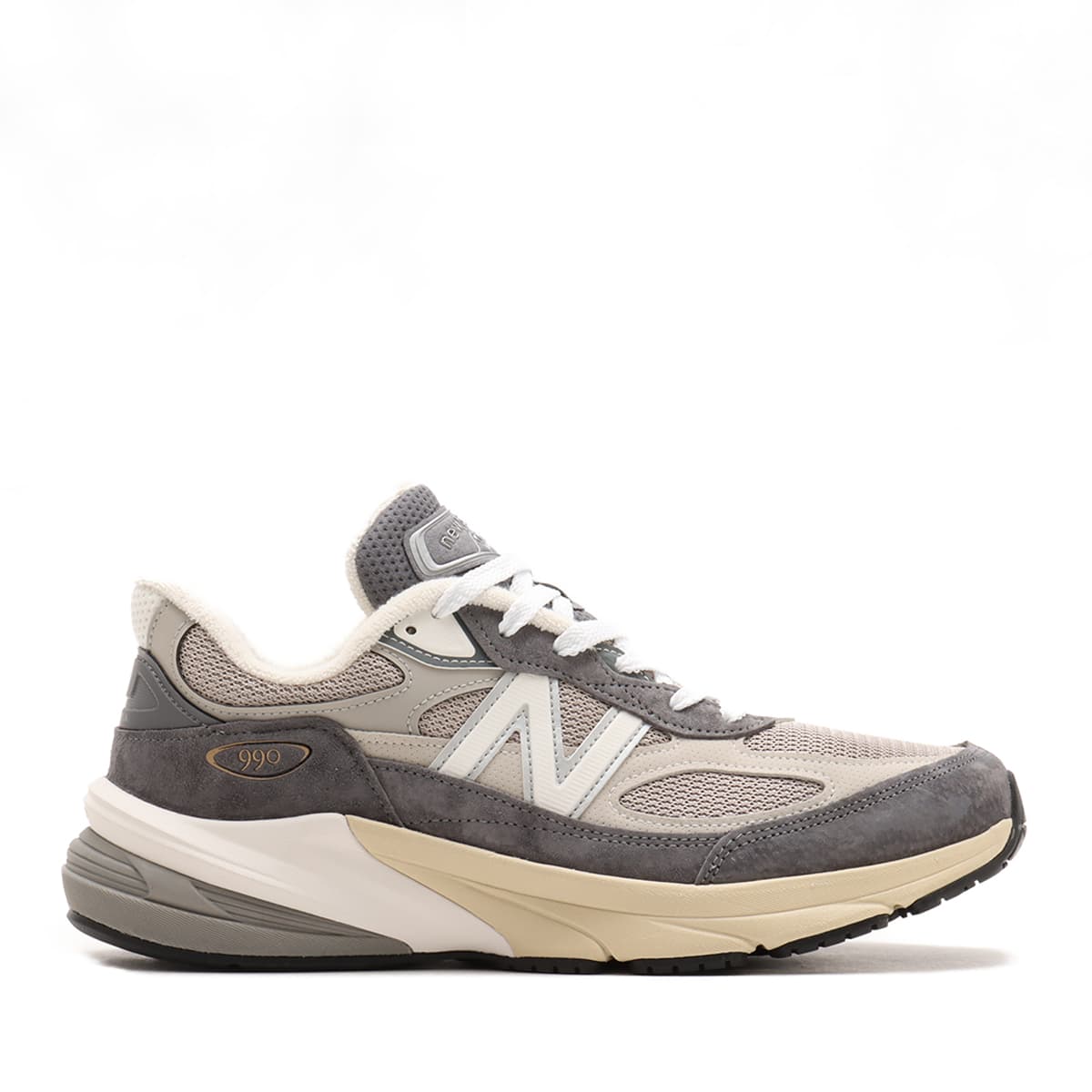 New Balance Made in USA 990v6 sneaker with a streamlined suede and mesh upper, FuelCell cushioning, and a modern grey colorway.