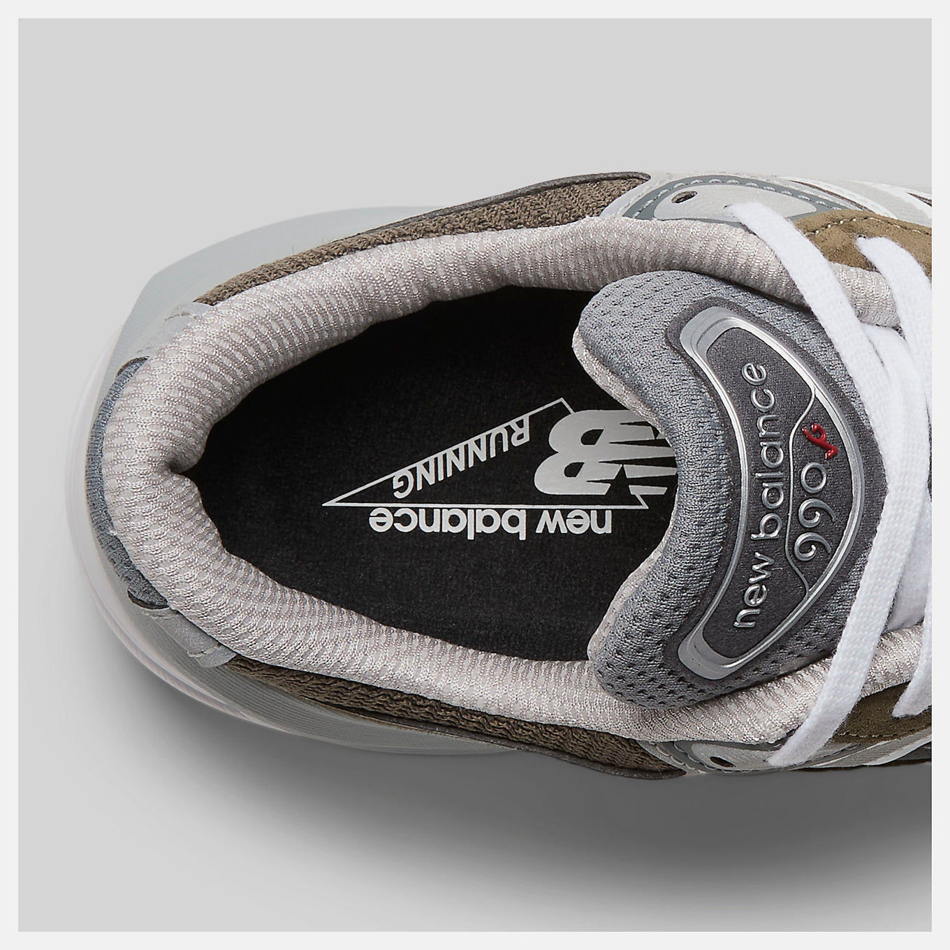 New Balance Made in USA 990v6 sneaker with a streamlined suede and mesh upper, FuelCell cushioning, and a modern grey colorway.