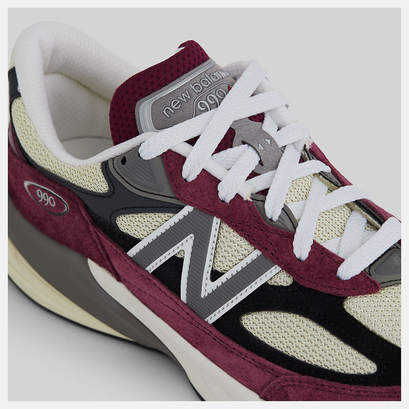 New Balance Made in USA 990v6 sneaker with a streamlined suede and mesh upper, FuelCell cushioning, and a modern grey colorway.